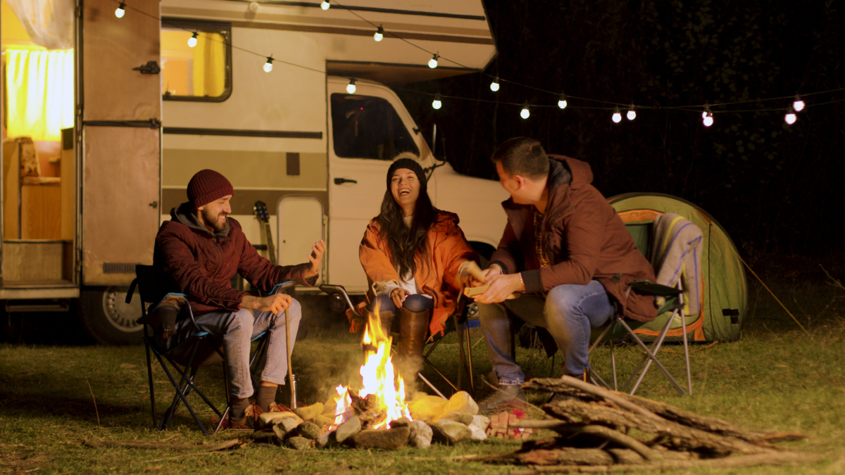 People sitting around a campfire